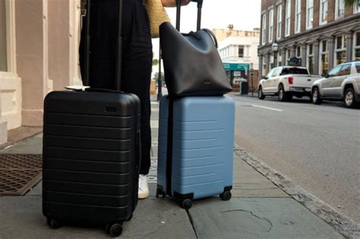 Which amtrak stations allow checked baggage?