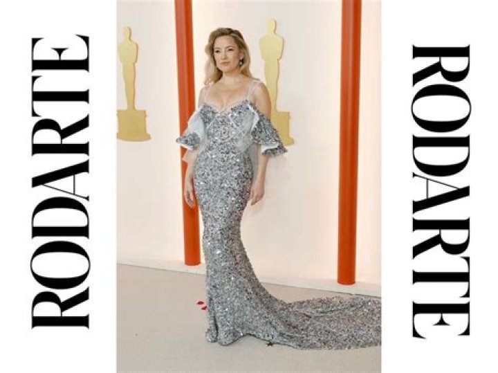 
Which designer did Kate Hudson wear for her 1st Oscar appearance? 
